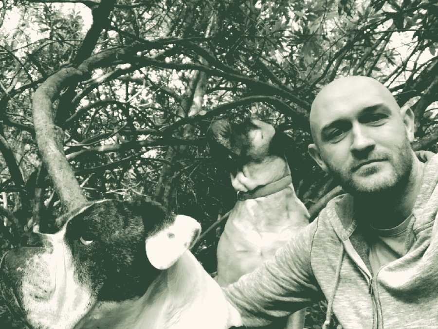 Carl Allott outdoors with his two dogs